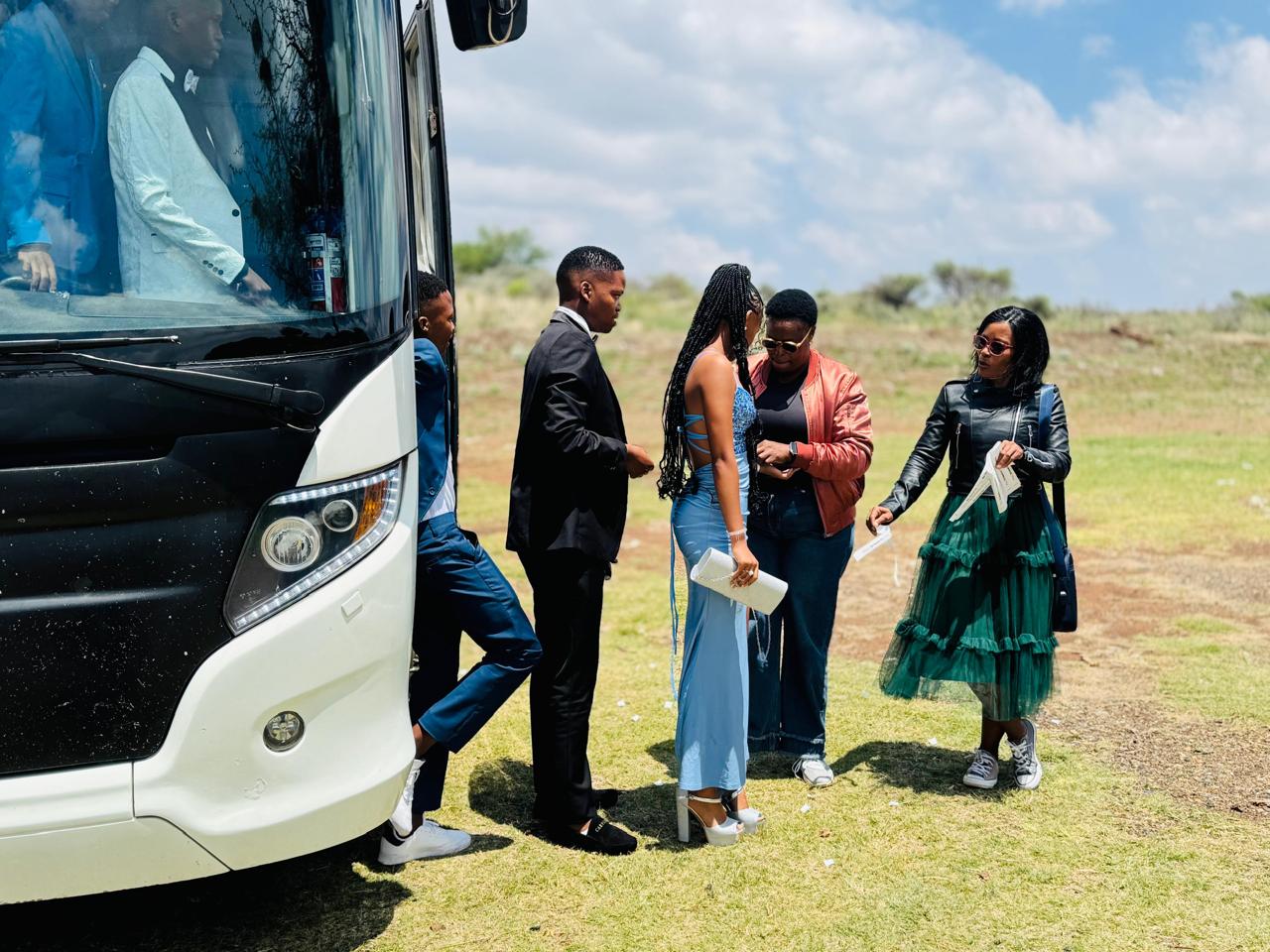 Passengers stepping out of a transport vehicle